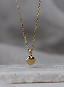 gold puffed heart necklace from salty threads